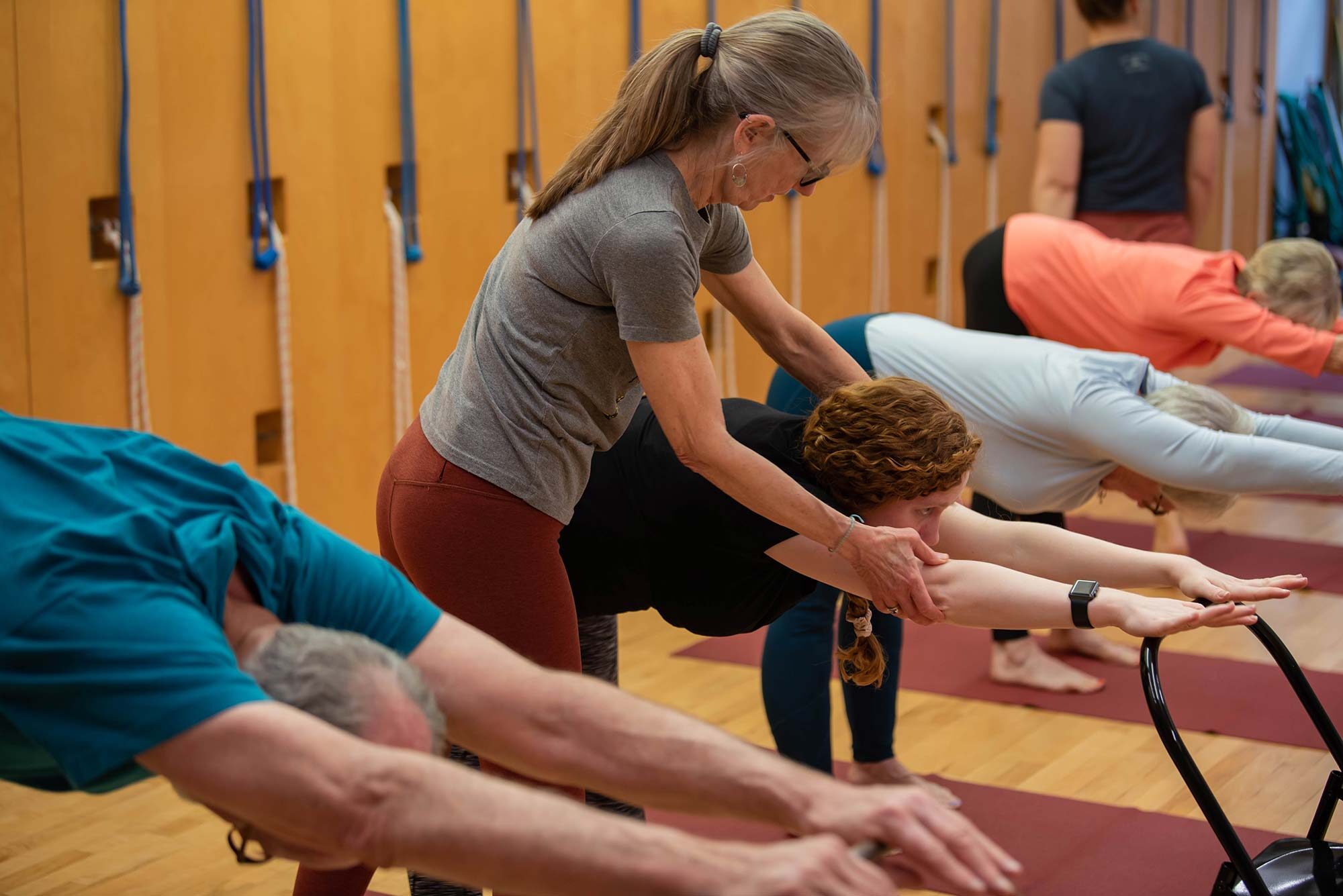 Pam owner yoga place guiding student