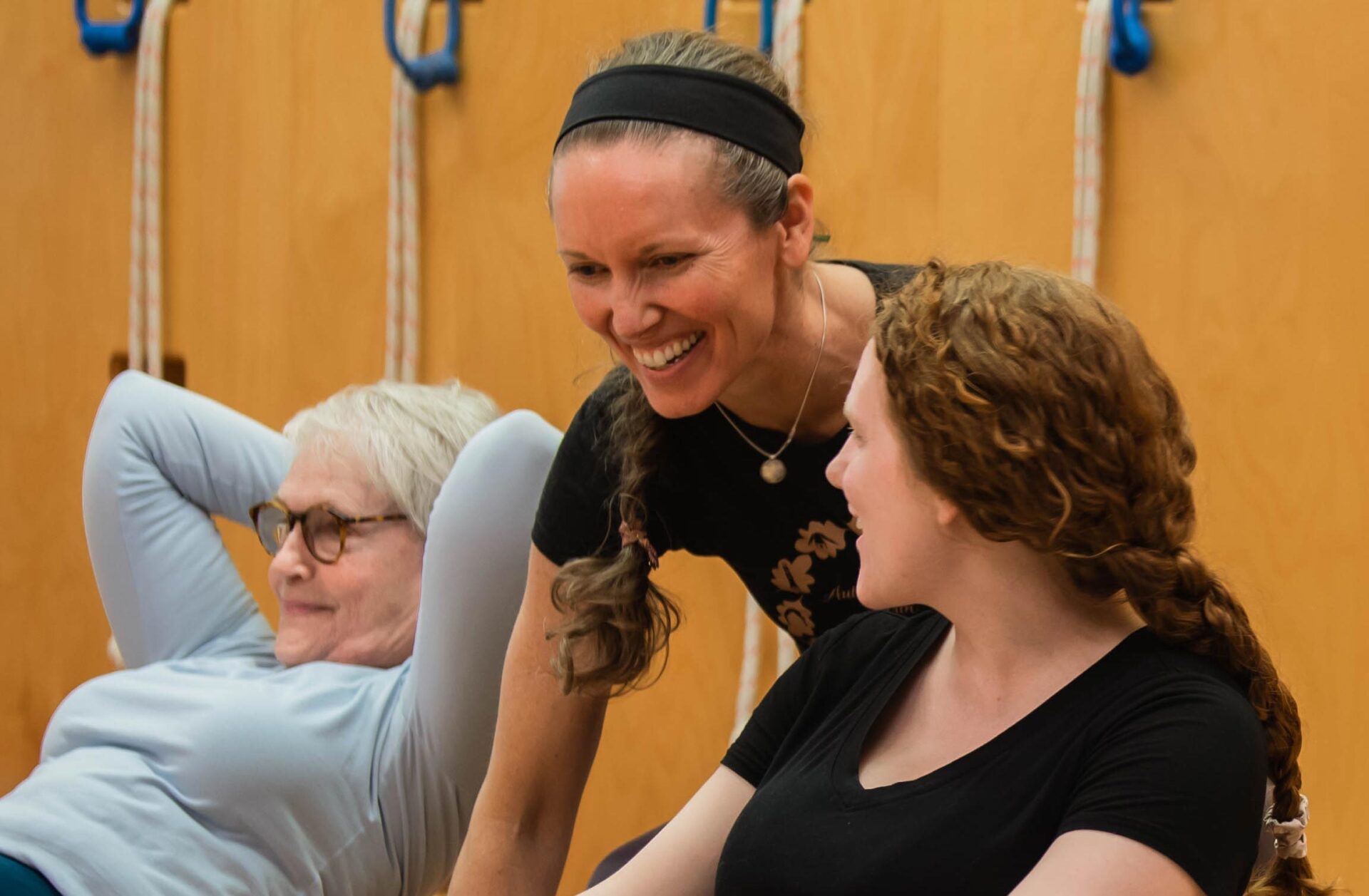 yoga instructor helping students